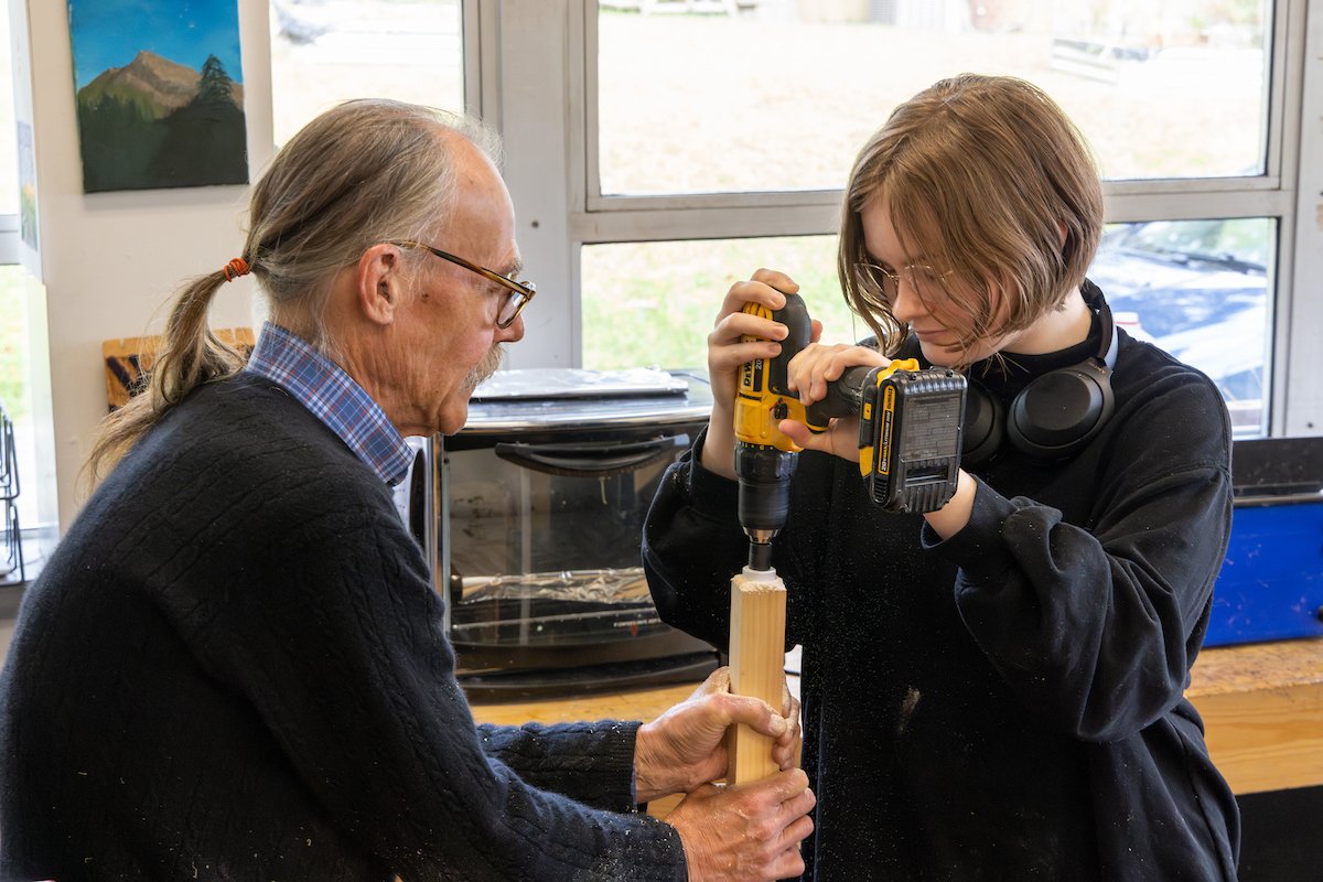 teacher and student in wood shop